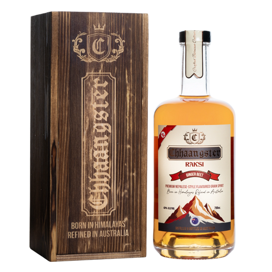 Bottle of Chhaangster Raksi Nepalese whisky with wooden box on a white background