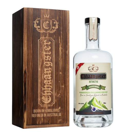 Bottle of Chhaangster Raksi with wooden box on a white background